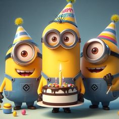 three minion characters standing in front of a birthday cake