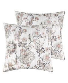 two pillows with floral designs on them