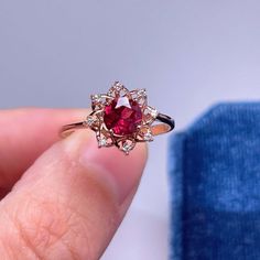 925 Sterling Silver Ring, Natural Garnet Red Stone Halo Ring, Ring for Women, Birthstone Ring for Women, Dainty Stackable Ring, Gift for Her.>>>> BASIC INFORMATION <<<< Gemstone: Natural GarnetRaw Stone Size: Round 6mmDainty CZ Diamond (shining zircon).Side stones: Shining CZ diamond (cubic zircon).Band color:Silver--18K white gold plated sterling silverRose Gold--18K rose gold plated sterling silverGold -- 18K yellow gold plated sterling silver>>>> CUSTOM MET Red Ruby Gemstone Flower Ring, Red Ruby Flower Ring With Gemstone, Red Gemstone Flower Ring, Red Ruby Flower Ring, Red Ruby Flower Ring Fine Jewelry, Ruby Gemstone Flower Ring For Promise, Red Diamond Flower Ring For Gift, Red Diamond Flower Ring As Gift, Red Diamond Flower Ring Gift