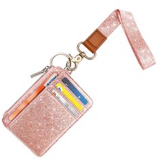 PRICES MAY VARY. Fashion cute glitter bling design, classic and chic glitter pink rose gold elements. unique design, simple but fashionable, good match to everyday use. The bright print augment the classic look, the design can go with any outfit and even it looks wonderful on your bare skin. 1 x Wrist lanyard, wallet holder with 6 x card slots, 1 x ID window, 1 x finger groove,1 x zipper pocket for money/bills. Easily holds your ID, Name Badge, Badge Holder, Cards, Money and Bills. Cute wrist la Pink Card Holder With Interior Key Chain As Gift, Rectangular Pink Badge Holders For Everyday Use, Pink Coin Purse With Card Slots For Personal Use, Pink Lanyard, Wallet Lanyard, Lanyard Wallet, Money Bill, Bling Design, Wrist Lanyard