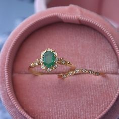 Natural oval green emerald engagement ring