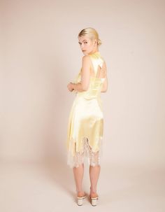 Pale yellow asymmetric silk skirt with metallic french lace Fastens with invisible zip at central backComposition: 100% Silk / Lace: 75% Lurex 25% NylonDry Clean OnlyFit and Model SizeModel wears UK size 6 and is 5'8'' (172 cm) Fits true to size, however those who are between sizes should take the larger size Light weight fabric, non stretch Designed to be fitted at waist, loose cut Elegant Silk Skirt With Lace Trim, Gold Satin Party Skirt, Summer Evening Skirt With Lace Trim, Chic Yellow Evening Skirt, Yellow Evening Skirt For Spring, Elegant Yellow Skirt For Wedding, Fitted Yellow Skirt For Night Out, Yellow Skirt For Summer Evening, Yellow Evening Skirt For Summer