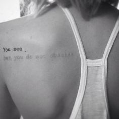 the back of a woman's shoulder with writing on it that says, you see what you do not believe