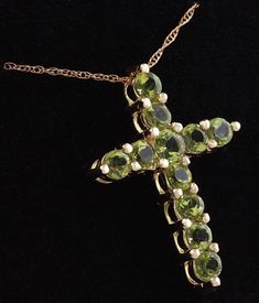 1.20 Carat Natural Green Peridot 14K Solid Yellow Gold Cross Pendant with Chain Amazing looking piece! Suggested Replacement Value: Approx. $1600.00 Total Natural Round Cut Green Peridots Weight: 1.20 Carat Chain Length is: 16 inches Pendant measures: Approx. 25 x 18.4mm Total item weight is: Approx. 2.1g Disclaimer: all weights, measurements and colors are approximate and may vary slightly from the listed dimensions or as seen in the image. All pictures are magnified to show the smallest of det Luxury Yellow Gold Peridot Jewelry, Formal Peridot Gemstone Necklaces, Formal Fine Jewelry With Peridot, Fine Jewelry Peridot For Formal Occasion, Luxury Peridot Jewelry For Gifts, Luxury Peridot Jewelry For Formal Occasions, Luxury Gold Jewelry With Peridot, Luxury Gold Peridot Jewelry, Fine Jewelry Peridot Necklace For Anniversary