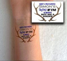 someone has their arm tattooed with deer antlers and the words, simon's play film buy me a drink