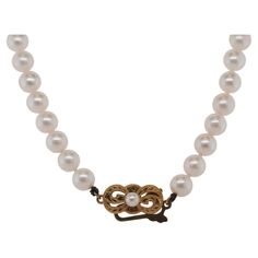 Metal Type: 18K Yellow Gold [Hallmarked, and Tested] Weight: 25.8 grams Pearl Details: Measurement: 6.5mm Shape: Round Luster: Pinkish Measurement: 18 Inches long Condition: Excellent Classic 14k Gold Pearl Necklace, Classic 14k Yellow Gold Pearl Necklace, Formal 14k Gold Pearl Necklace, Classic Single Strand Pearl Necklace In 14k Gold, Elegant Round Necklace With Gold Clasp, Elegant Necklace With Gold Clasp, Classic Yellow Gold Necklace With Gold Clasp, Classic 14k Gold Pearl Necklace For Anniversary, Classic Gold Pearl Necklace For Formal Occasions