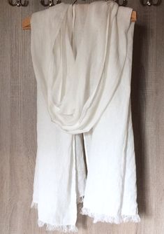 "Ready for shipping shawl in size * 27\" x 100\" (69 x 255cm) * 17.5\" x 80\" (44 x 200cm). Material - lightweight 100% natural linen. Fabric is prewashed, naturally wrinkled. Natural white (light ivory) color. Frayed ends. Scarf is long enough to wear it in different ways - wrap around your neck, shoulders, head or hips. Perfect for wedding, beach party or trip. Scarf will protect you from sun or evening breeze. You will always feel comfortable because linen is hypoallergenic, hygroscopic, it a White Shawl Scarf For Summer, White Silk Shawl Scarf For Summer, Elegant White Silk Scarf For Beach, Bohemian Linen Shawl, Bohemian Linen Shawl Scarf, Wedding Beach Party, Bridal Wrap, Scarf For Women, Men Beach