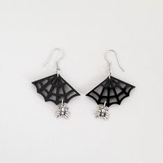 "These cute spiderweb earrings are the perfect gift for any girl who loves spiders. 💀 DESCRIPTION: This pair of drop earrings features small 3-D cast spider charms that hang from gloss black spiderwebs. They were attached to hypoallergenic stainless steel ear wires. 💀 SIZE & MATERIALS: The spiderwebs were laser cut from acrylic. The spider charms were made from sterling silver and measure approximately 3/8\". The ear wires are made from hypoallergenic stainless steel. Overall, the earrings Hematite Crystal, Spider Earrings, Cocktail Earrings, Evening Jewelry, Gothic Gifts, Gothic Earrings, Light Weight Jewelry, Buy List, The Spider