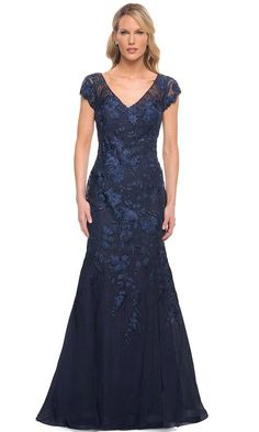 Take center stage in this dazzling look by La Femme 30269. This lace gown's V neckline and sheer cap sleeves stand out. A sheer laced illusion reveals a mid-open back lining and zips up the back. The skirt has a full length hem with a train and a mermaid silhouette. With this La Femme dress, you'll look sophisticated and classy. The model is dressed in navy. Tulle Mermaid Dress, Velvet Sheath Dress, Dress Couture, Dresses Style, Long Evening Gowns, Mermaid Silhouette, Lace Evening Dresses