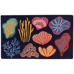 an area rug with different colored seaweed and corals on the front of it