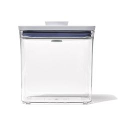 a clear container with a blue lid on a white background