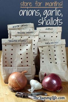 there are many different bags with onions in them and other things on the table next to it