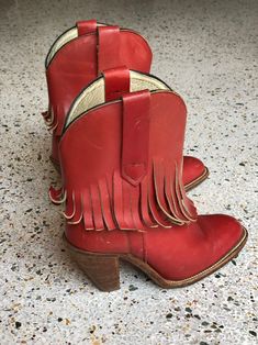 "1970's brick red fringed low height cowboy boots with a great patina by Frye. Estimated Size: US 5.5 Vintage size marked: 6 B Insole: 9\" Width: 3.25\" Heel height: 2.5\" Circa: 1970's Condition: Good vintage condition. Subtle wear, scuffs / marks. SOLD AS-IS. Follow us on Instagram for the latest----> http://instagram.com/closetcasevintage @closetcasevintage Please contact us about any questions you may have regarding condition before purchasing. Read the blog for updates, giveaways and sty Red Western Heeled Boots With Snip Toe, Red Bohemian Boots For Fall, Red Western Heeled Boots With Round Toe, Red Western Style Heeled Boots With Round Toe, Red Heeled Boots For Rodeo In Fall, Red Round Toe Heeled Boots For Rodeo, Red Leather Heeled Boots For Rodeo, Bohemian Red Leather Boots, Vintage Red Boots For Fall