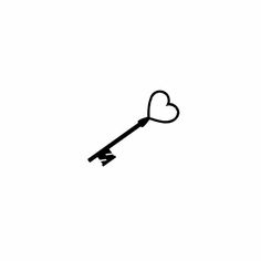 a black and white photo of a key with a heart on the end is shown