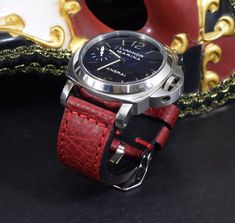 RECOMMENDATION FOR STRAP LENGTH : WRIST SIZE 15-17 CM - 115/75 MM STRAP LENGTH WRIST SIZE 17,5-19 CM - 130/80 MM STRAP LENGTHCaracteristics: Model : VINTAGE - BOX RED I Genuine BOX - CALF LEATHER Color : Red Handmade ONLY VALID FOR TANG BUCKLE (PHOTOS) Width : 26/24/22 mm (at the watch) - 26/24/22 mm (at the buckle) Length : 130 / 80 mm - 115 / 75 mm Thickness : aprox. 3,5 - 4 mm Edges : burnished - matte Keeper : 1 fix + 1 floating Inox. tubes included (Width 26 + 24 mm) Waterproofed: NO Logo s Red Watch With Adjustable Leather Strap, Red Leather Strap For Watches, Red Adjustable Leather Strap For Watches, Red Rectangular Watch Band With Bracelet Strap, Red Bracelet Strap Watch Band As Gift, Red Leather Strap Watch Bands As Gift, Classic Red Watch Bands For Gift, Classic Red Watch Bands As Gift, Classic Red Watch Accessories For Gift