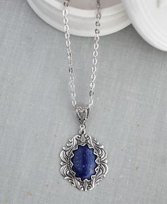 Lapis Lazuli Necklace. Cabochon measures 18x13mm. Pendant measures 32x25mm. Chained in nickel free silver plated chain. Closes with a lobster clasp. Length pictured is 18 inches long.  See the matching earrings here: https://www.etsy.com/your/shops/WearitoutJewelz/tools/listings/stats:true/675449046 Visit my shop today to see other great items. :) http://www.etsy.com/shop/WearitoutJewelz ♥ All items carefully packaged in a pretty gift box. Antique Silver Nickel Free Oval Necklace, Antique Silver Oval Nickel-free Necklace, Fandom Jewelry, Lapis Lazuli Necklace, Necklace Gemstone, Pillow Forms, Winter Clothing, Pretty Gift, Dark Academia