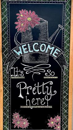 a chalkboard sign that says, welcome it's pretty here