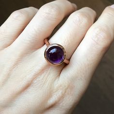 A classic, simple Purple Amethyst ring! Faceted Amethyst Round Jewelry, Adjustable Amethyst Birthstone Ring, Amethyst Ring With Round Stone, Amethyst Gemstone Stackable Rings As Gift, Handmade Amethyst Crystal Ring, Gift Stackable Amethyst Gemstone Rings, Purple Topaz Ring Gift, Fine Jewelry Amethyst Round Rings, Purple Topaz Ring For Gift