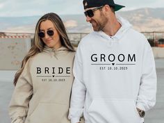 The hoodies are sold separately. Please, Be careful when ordering whether the product is a hoodie or a sweatshirt Personalized Bride and Groom Sweatshirt, Wedding Hoodie, Custom Couple Hoodie, Matching Couple, Wedding Gift, Just Married Gift, Wifey Hubby Gildan Hoodies/Sweatshirts - the perfect blend of comfort, style, and sustainability. Crafted with a careful balance of 50% cotton and 50% polyester, these premium garments offer exceptional softness, durability, and eco-consciousness.  Our Hood Just Married Outfit, Wedding Party Hoodies, His And Hers Hoodies, Wedding Hoodie, Funny Matching Shirts, Cute Couple Shirts, Wifey Sweatshirt, Couples Sweaters, Matching Hoodies