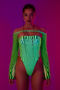 For an outfit that says: “I break rules and I look damn good doing it”. Featuring a bandeau bodysuit, an off-the-shoulder mesh shrug and a pair of sexy mesh leg warmers, this set will take your festival look to new heights. A textured print paired with electric green hues creates an eye-catching pattern that exudes attitude from every nook. Experiment with styling, break it down or dress it up, own the scene and make a statement of style. FEATURES: > Off-the-shoulder Shrug > Sleeveless Bodysuit > Flared Leg Sleeves > Non-Transparent Lycra & See-Through Soft > Mesh Fabric (80% Polyester 20% Elastane) Open Front Skirt, Mesh Shrug, Shoulder Shrug, Romper Men, Rave Bodysuit, Electric Green, Full Body Suit, Leg Sleeves, Green Hues