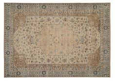 an antique persian rug with blue and beige colors