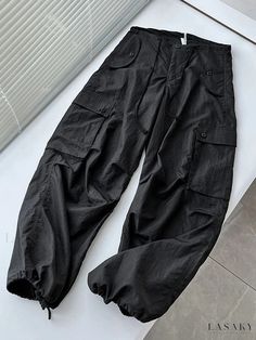 Easton Cargo Pants with Spliced Details Black Relaxed Fit Patchwork Bottoms, Black Relaxed Fit Bottoms With Patchwork, Black Patchwork Bottoms With Relaxed Fit, Relaxed Fit Black Bottoms With Patchwork, Casual Patchwork Bottoms For Work, Sporty Spring Pants With Patch Pockets, Spring Black Cargo Pants With Patch Pockets, Black Patchwork Full-length Bottoms, Casual Patchwork Cargo Pants