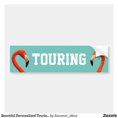 a sticker with two flamingos and the words tour on it's side