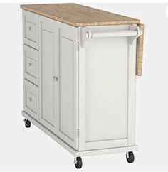 a white kitchen island with drawers on wheels