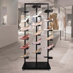 there is a display case with many pairs of women's shoes on the shelves