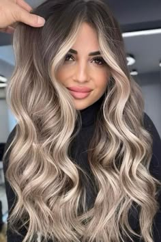 Long layered hair with a smooth transition from dark roots to ash blonde waves, creating depth and movement. The curtain bangs frame the face beautifully, complementing the voluminous and textured style.  // Photo Credit: Instagram @burakakdogan.official Blonde Honey Balayage, Honey Balayage Hair, Hairstyles For Blondes, Dark Roots Blonde Hair Balayage, Ashy Blonde Hair, Blond Beige, Blonde Hair With Roots