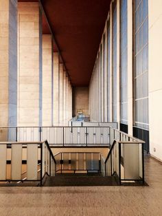 the inside of an empty building with metal railings