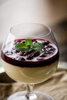 a close up of a dessert in a glass on a table