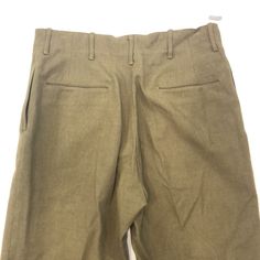 Vintage 1950s-1980s Military Pants Size: 31” Measurements: waist: 31” top to bottom crotch: 12” Classic High Waist Chinos With Belt Loops, Fitted Cotton Wide Leg Pants With Welt Pockets, Wool Straight Leg Pants With Belt Loops, Fitted Wide Leg Cotton Pants With Welt Pockets, Fitted Cotton Wide Leg Pants With Pockets, Fitted High Waist Wool Bottoms, Fitted Wool High Waist Bottoms, Fitted Wool High-waisted Bottoms, Classic Tapered Bottoms With Hip Pockets