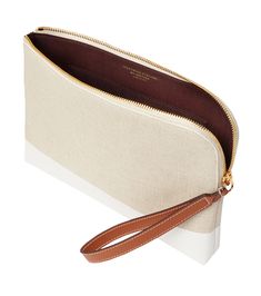 a white and brown purse on a white surface