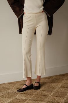 The Rib Kick Flare Fitted Bottoms With Cropped Leg And Seam Detailing, Fitted Bottoms With Seam Detailing And Cropped Leg, Chic Ribbed Elastane Bottoms, Fitted Spring Bottoms With Cropped Hem, Fitted Cropped Bottoms For Spring, Spring Ribbed Elastane Pants, Spring Ribbed Elastane Bottoms, Ribbed Flare Pants For Loungewear, Flare Ribbed Pants For Loungewear