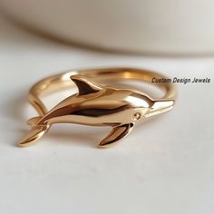 14K Gold Plated Dolphin Ring, Dainty Minimalist Dolphin ,Women's Dolphin Ring ,Gold Plated Cute Dolphin Ring , Dolphin Ring, Fish Ring  💙ITEM DETAILS💙 ♥️ Item :  Dolphin Ring  ♥️ Material: 925 Silver ♥️ Size: Select the Variations ♥️ Stone: No                                               CUSTOME DESIGN JEWELS ♣️ NOTE:- Product color may be some different due to photographic lighting sources or your monitor setting. ♣️ Product & gemstone weight may vary from actual products. ♣️ Shown Products Dolphin Ring, Fish Ring, Photographic Lighting, Stackable Rings, Dolphins, Custom Jewelry, 925 Silver, Gold Plate, Jewelry Rings