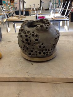 a vase sitting on top of a wooden table