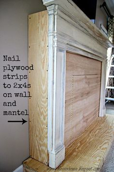 an unfinished fireplace surround with nails and plywood strips to attach the trim on the mantle