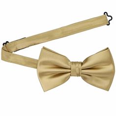 Our premium golden champagne bow ties are pre-tied with a band collar style that expands to fit most adult neck sizes up to 19-inches. Its heavyweight woven material and smooth satin finish provide a sharp look that is suited for your most formal occasions. Slightly larger than our standard bow ties. We recommend this shade for a dark beige or sand color. See it in person by requesting a free color swatch. Product Features Pre-tied band collar bow tie Men's size Bow measures approximately 5" acr Adjustable Solid Bow For Formal Occasions, Adjustable Solid Color Formal Bow, Classic Gold Suit And Tie Accessories With Bow Tie, Adjustable Solid Color Bow For Formal Occasions, Classic Gold Suit And Tie Accessories With Satin Bow, Classic Gold Suit Accessories With Satin Bow, Adjustable Satin Bow Tie For Formal Occasions, Classic Solid Color Bow Tie For Wedding, Gold Adjustable Suit And Tie Accessories For Party