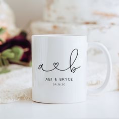 a white coffee mug with the word abi and bryce written on it