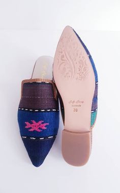 Crafted by artisans skilled in the great Turkish shoemaking tradition, our handmade ikat mules are crafted of genuine leather soles and only the finest natural cotton kilim, raw silk and silk velvet textiles available. As each of our stunning ikat mules are made by hand, no two pairs are exactly alike. Thus, each pair of these luxury mules is entirely unique -- just like you! Our luxury ikat mules are available in a wide array of colors and patterns, in both rounded and pointed toe-styles. We of Artisan Closed Toe Mules With Leather Sole, Bohemian Handmade Slip-on Mules, Handmade Bohemian Slip-on Mules, Handmade Artisan Mules For Summer, Traditional Summer Mules With Rubber Sole, Artisan Handmade Slip-on Mules, Handwoven Slip-on Mules, Traditional Handmade Flat Mules, Handmade Slip-on Mules