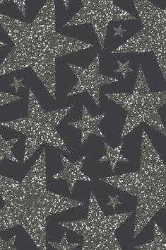 black and silver glitter stars on a dark background