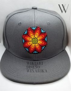 WIKIARI Cap. Huichol artisan cap Unique and exclusive designs from WIKIARI, handmade by our Wixárika artisans. Available in: -Flat Cap (Snapback) -Curved Cap (Baseball Cap) SHIPPING INCLUDED! FREE SHIPPING! We are WIKIARI Diseño Wixárika a social enterprise, 100% Mexican connected with Huichol art focused on the dissemination and design of unique pieces of Wixárika art in Mexico. We are WIKIARI Diseño Wixárika a social company, 100% Mexican connected with Huichol art focused on the spread and design of unique pieces of Wixárika art in Mexico. Adjustable Gray Hat For Gift, Casual Handmade Snapback Hat, Adjustable Artisan Hat As A Gift, Artisan Adjustable Hat As Gift, Artisan Adjustable Hat As A Gift, Handmade Flat Brim Hat As Gift, Multicolor Adjustable Flat Brim Hat, Adjustable Multicolor Flat Brim Fitted Hat, Artisan Multicolor Hats As Gifts