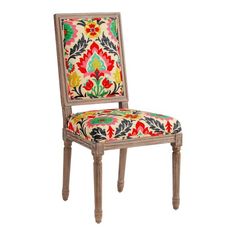 an upholstered chair with colorful fabric on it's back and seat cushion