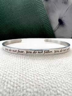 Officially Licensed Quote cuff bangles are inspired by the Sarah J Maas series ACOTAR. Choose from Single sided: You do not fear. You do not falter. You do not yield Only you can decide what breaks you Double sided: Front- To the stars who listen and the dreams that are answered Inside- Take me home to Velaris Please note gold tone is gold plated with heart cut outs on bangle end. Material: Steel ,it is quite rigid, slight adjustments is possible. Bangle thickness- 4mm Dimensions approx 7cm x 5c You Do Not Fear You Do Not Falter, Velaris Ring, Only You Can Decide What Breaks You, Acotar Jewelry, Bat Boys, A Court Of Wings And Ruin, Heart Cut Out, Simple Face, A Court Of Mist And Fury