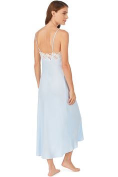 This soft satin nightgown is the definition of chic, designed with a flattering drape and a delicate neckline of floral netting lace. Straps are adjustable. For a stunning set, pair it with the matching Santorini Satin Wrap Robe. Style Number: E5220075-111 and E5220075-450 Length: 53" 100% PolyExclusive of ornamentation Model is wearing size S. She is 5'9.5", Bust 34", Waist 24", Hips 35" Imported Daywear Satin Dress With Lace Trim, Satin Dresses With Lace Trim For Daywear, Satin Daywear Dress With Lace Trim, Feminine Lace Gown With Lace Trim, Sheer Satin Dress For Daywear, Feminine Silk Dresses With Delicate Lace, Elegant Lace Bodice Nightgown For Evening, Elegant Evening Nightgown With Lace Bodice, Sheer Feminine Satin Dress