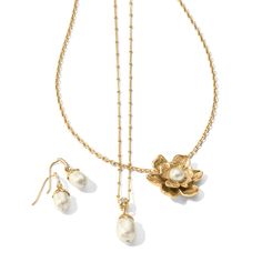 Add a touch of nature to your wardrobe with our Everbloom Pearl Flower Necklace. Featuring a delicate oval pendant with a gold-capped floral design, this necklace is perfect for layering and adds a touch of elegance to any outfit. The pearl center adds a touch of glamour to the petal design. Color: Gold-Pearl Closure: Lobster Claw Length: 18" - 21" Adjustable Pendant Drop: 3/4" Material: Fine quality glass pearl Finish: Gold plated Elegant Pearl Chain Flower Necklace, Elegant Flower Necklace With Pearl Chain, Elegant Flower-shaped Pearl Chain Necklace, Elegant Flower Necklace With Pearl Chain As Gift, Elegant Pearl Chain Flower Necklace As Gift, Elegant Oval Pendant Necklaces With Flower Charm, Elegant Oval Pendant Necklace With Flower Charm, Elegant Pearl Flower Necklace, Elegant Pearl Flower Necklace With Pearl Chain