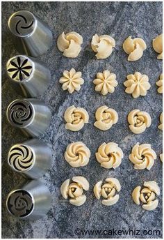 several different types of doughnuts are on the counter next to some cookie cutters