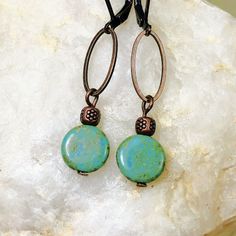 Turquoise glass beads dangle from copper loops to create these simple, stylish Boho earrings. This beautiful combination of turquoise and copper is a modern classic look. Czech glass beads in coin shape are lovely with a Picasso finish.  Perfect for any occasion, spice up your look with these earrings.  Hypoallergenic ear wires (nickel and lead free). Choose ear wire style at checkout.  Free gift packaging included. Earrings are carded and in an organza bag. Artisan glass beads produced in small Bohemian Czech Glass Beaded Earrings, Unique Turquoise Earrings With Czech Glass, Turquoise Czech Glass Earrings With Dangling Beads, Turquoise Round Copper Earrings, Bohemian Turquoise Czech Glass Beaded Earrings, Turquoise Czech Glass Dangling Beads Earrings, Czech Beads Jewelry, Hoop Earrings Diy, Hardware Jewelry