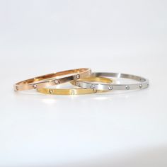 Basically a tradition. Our Ruth Bangle Bracelet is the traditional wrist companion you need for adding a touch of luxury to any outfit. Perfect to stack or to wear solo - Ruth is versatile and gorgeous. Elegant Silver-gold Plated Bangle, Everyday Gold-toned Sterling Silver Bangle, Classic Silver Tarnish-resistant Bangle, Luxury Silver Brass Bangle, Luxury Silver Tarnish-resistant Bangle, Buckle Bracelet, Stone Collection, Chain Ring, Drop Necklace